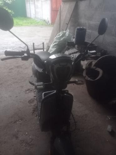 Электроскутер городского типа - Компоновка: шаг‑тру (низкая рама)