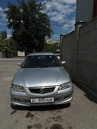 чехлы на морнинг: Mazda Capella: 2001 г., 2 л, Механика, Бензин, Седан — 1