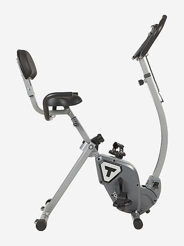 Велотренажер серого цвета с черными элементами, оснащенный сиденьем со