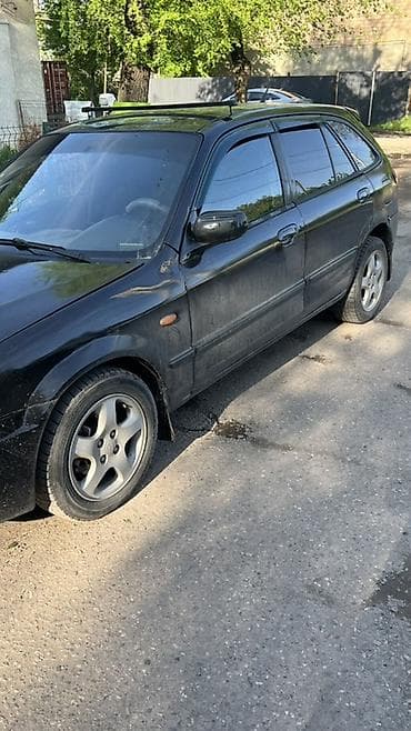 mini copper: Mazda 323: 2001 г., Универсал — 2