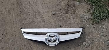 обмен на колонку: Крыло Переднее правое Mazda — 2