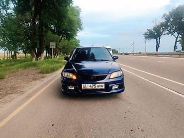 Mazda Familia: 2002 г., Хэтчбэк — 1