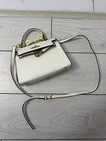 Женская сумка мини формата с верхней ручкой и длинным регулируемым