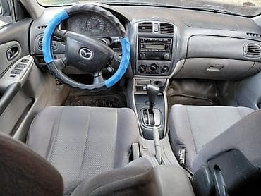 Mazda 323: 2000 г., 1.6 л, Автомат, Бензин, Хэтчбэк — 5