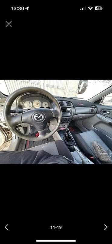 Mazda 323: 2004 г., Хэтчбэк — 10
