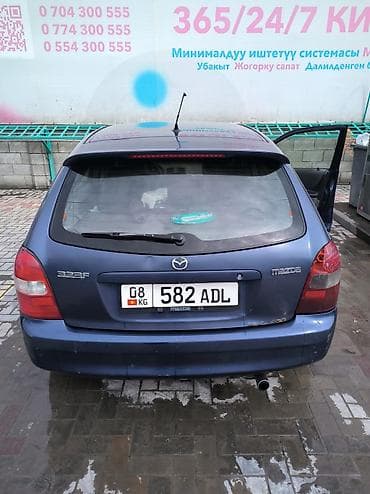 продаю бетономешалки: Mazda 323: 2001 г., 1.6 л, Механика, Бензин, Хэтчбэк — 4