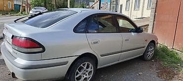 с4 2 3: Mazda 626: 1998 г., 1.8 л, Механика, Бензин, Хэтчбэк — 5