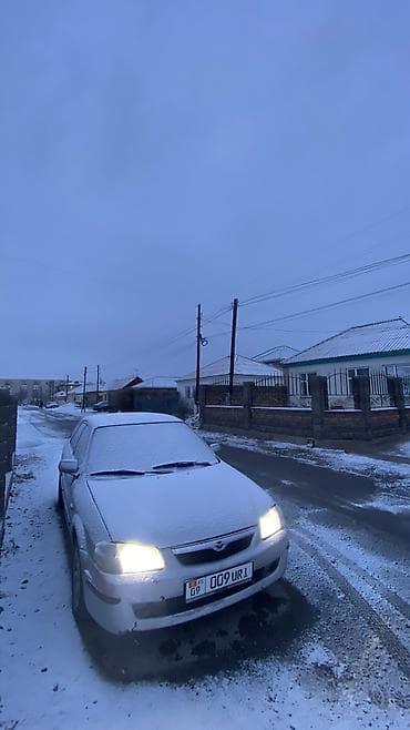 bnw x5: Mazda 323: 1998 г., 1.6 л, Механика, Бензин, Универсал — 1