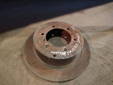 перфорированные тормозные диски: Mitsubishi Pajero Sport / Montero Sport тормозной диск, Митцубиси — 1