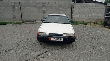 бир: Mazda 626: 1991 г., 2 л, Кол менен иштөөчү, Бензин, Лифтбек — 2