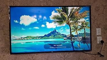smartfony do 5000 grn: Телевизор LG, диагональ экрана около 43–49". Узкие рамки, настенное — 3