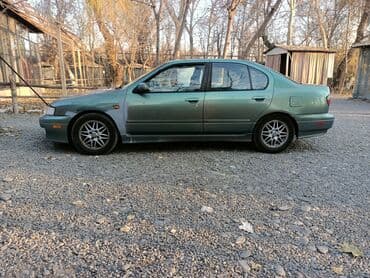 значок на авто: Nissan Primera: 2000 г., 2 л, Автомат, Бензиновая, Седан — 4
