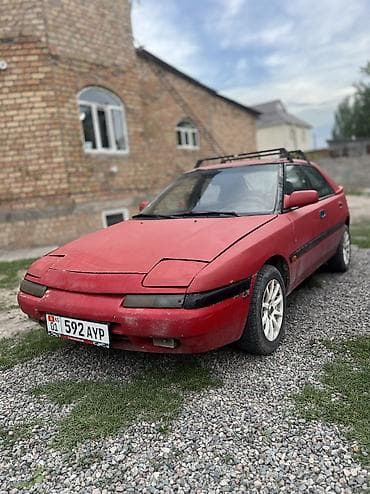lexus e300: Mazda 323: 1990 г., 1.6 л, Механика, Бензин, Лифтбек — 5