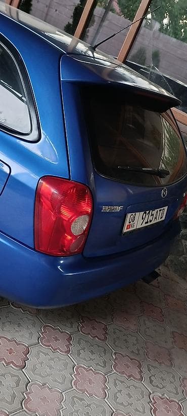 Унаа: Mazda 323: 2003 г., 1.6 л, Кол менен иштөөчү, Бензин, Хетчбек — 9
