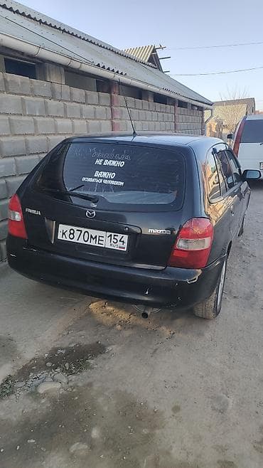 rf 2: Mazda Familia универсал, черный цвет кузова. Кузов: - Универсал — 3