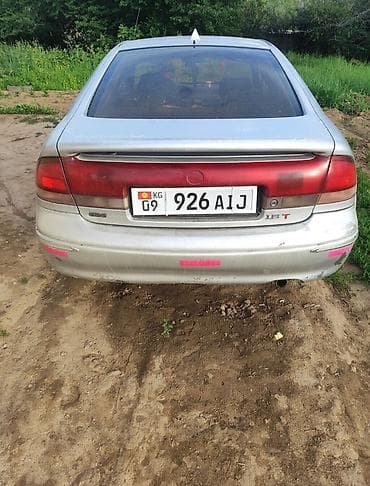 zimmer e9 pro: Mazda 626: 1997 г., 1.8 л, Механика, Бензин, Лифтбек — 4