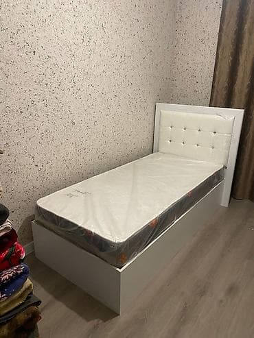 Односпальные кровати: Односпальная кровать с мягким высоким изголовьем. Описание: - Корпус — 1