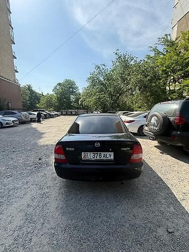 e klass: Mazda 323: 2002 г., 1.5 л, Автомат, Бензин, Седан — 1