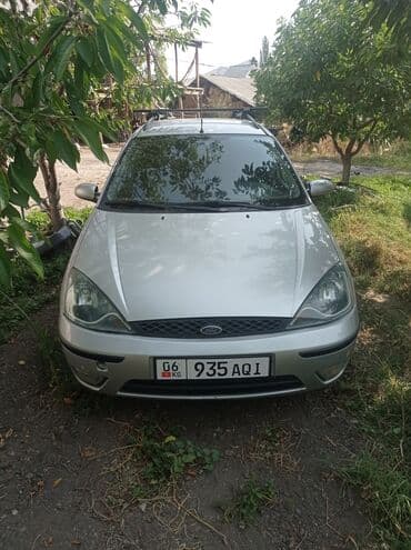 нива универсал: Универсал Ford Focus первого поколения, выполненный в серебристом — 1