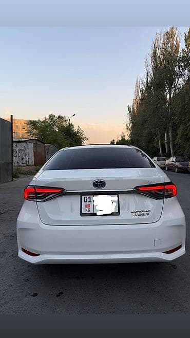 byd e2 2023: Toyota Corolla: 2020 г., Гибрид, Седан — 2