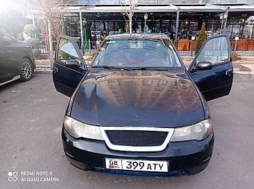 ford focus 2002: Седан темно-синего цвета на киргизских номерах (KG, номер 399 ATY) — 1