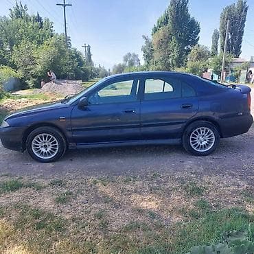харизма: Mitsubishi Carisma: 1988 г., 1.6 л, Автомат, Бензин, Седан — 4