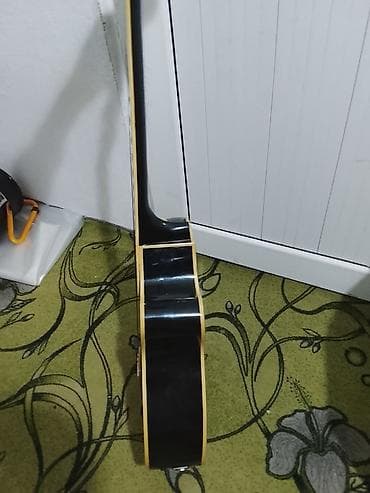 детский баян: Акустическая гитара с вырезом (cutaway), черный глянец. - Корпус — 2