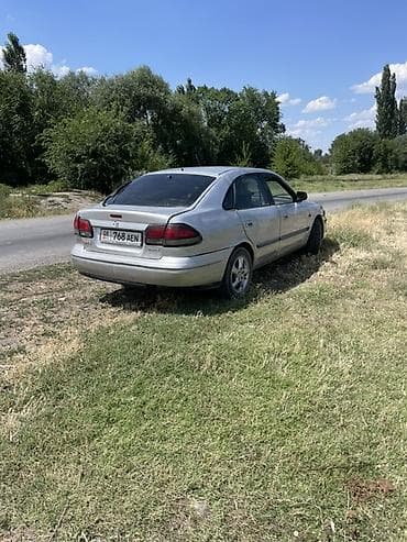 газ 69: Mazda 626: 1999 г., 1.8 л, Бензин, Седан — 5