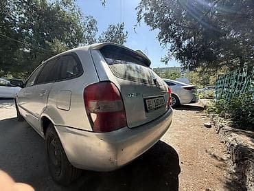Mazda 323: 2001 г., 1.5 л, Автомат, Бензин, Универсал — 4