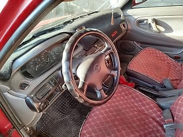 кирг шёлк: Mazda 323: 1995 г., Седан — 8