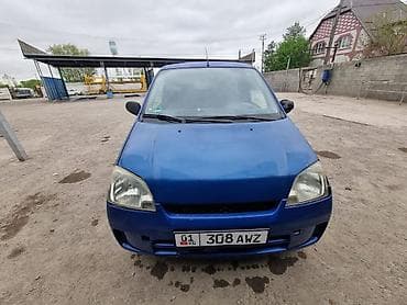 dio 27: Daihatsu Cuore: 2004 г., 0.9 л, Механика, Бензин — 1