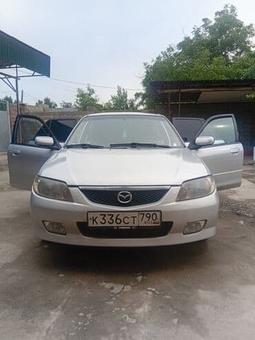 автомобиль бу: Mazda 323: 2003 г., 1.3 л, Механика, Бензин, Хетчбек — 16