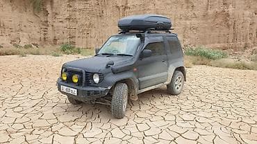 капот митсубиси: Mitsubishi Pajero Junior: 1995 г., 1.1 л, Автомат, Бензин, Внедорожник — 1