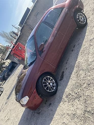 миленим: Mazda Familia: 1998 г., Бензин, Седан — 2