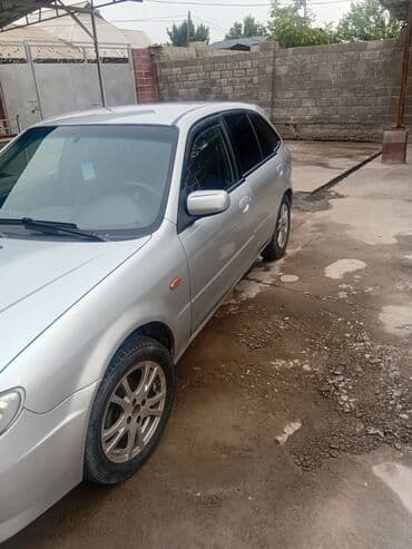 автомобиль бу: Mazda 323: 2003 г., 1.3 л, Механика, Бензин, Хетчбек — 3