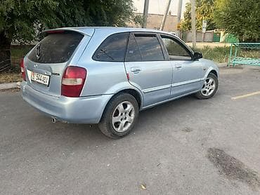 e 303: Mazda 323: 2001 г., 1.6 л, Механика, Бензин, Универсал — 4