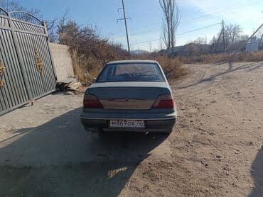 наклейка на машине: Daewoo Nexia: 2001 г., Механика, Бензин, Седан — 4