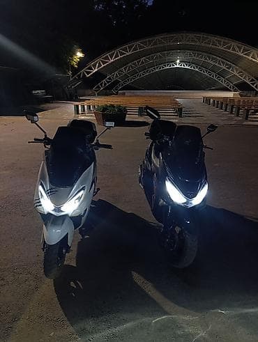 скутер н макси: Максискутер белого цвета с агрессивным дизайном Основные особенности — 6