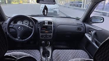 mini kooper: Mazda 323: 2001 г., 1.6 л, Ручные, Бензин, Хэтчбэк — 8