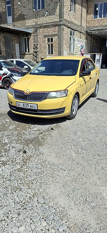 авто стенд: Skoda Rapid: 2015 г., 0.6 л, Механика, Бензин, Седан — 2