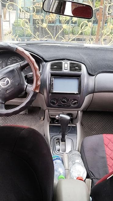 Транспорт: Mazda 323: 2002 г., 1.6 л, Автомат, Бензин, Универсал — 2