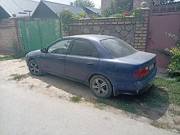 e34 520: Mazda 323: 1995 г., 1.5 л, Механика, Бензин, Седан — 4