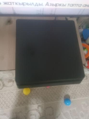 Игровая приставка Sony PlayStation 4 Slim (чёрная) - Компактный