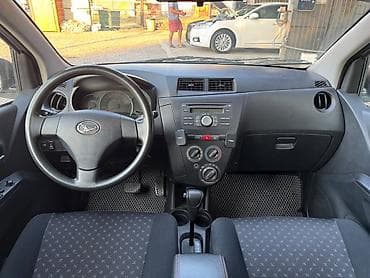 byd e1: Daihatsu Cuore: 2009 г., 1 л, Автомат, Бензин, Хэтчбэк — 6