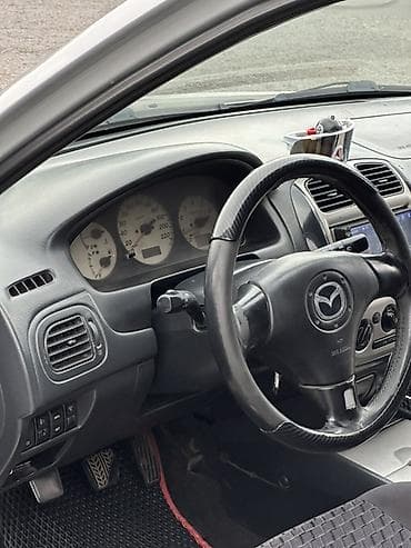 обмен на хариер: Mazda 323: 2001 г., 1.6 л, Механика, Бензин, Хэтчбэк — 7