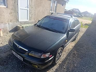 кочкор авто: Mazda 323: 1999 г., 1.8 л, Кол менен иштөөчү, Бензин, Седан — 6