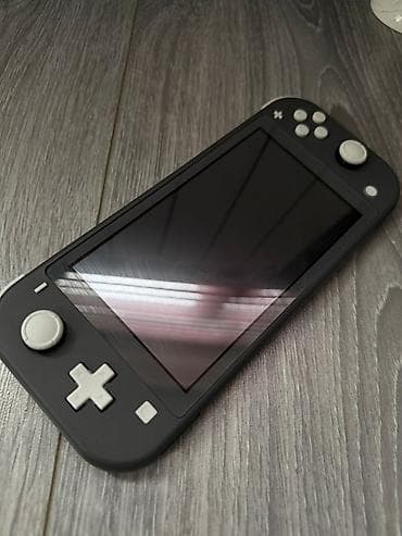 Nintendo Switch (Lite): Nintendo Switch Lite (серый) - Портативная консоль Nintendo с цельным — 1