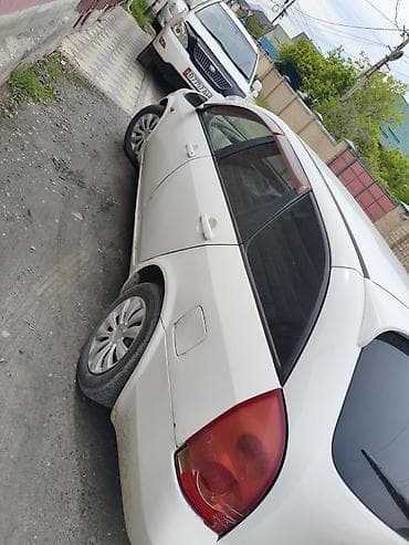митсубиси спейс стар: Nissan Primera: 2002 г., Универсал — 1