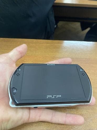 ps camera: Sony PSP Go (N1000) — портативная игровая консоль с выдвижным — 2
