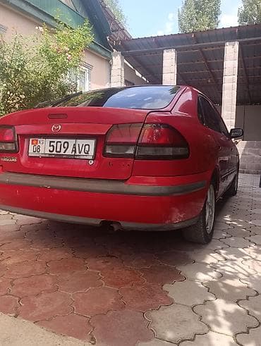 бампер на демио: Mazda 626: 1998 г., 2 л, Механика, Бензин, Лифтбек — 3